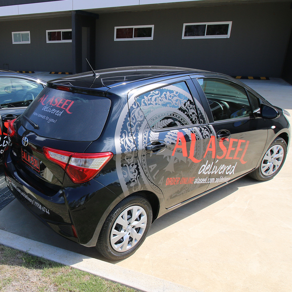 al aseel, delivery, toyota, yaris , vehicle, signage